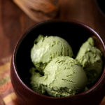 A matcha bowl filled with matcha green tea ice cream scoops.